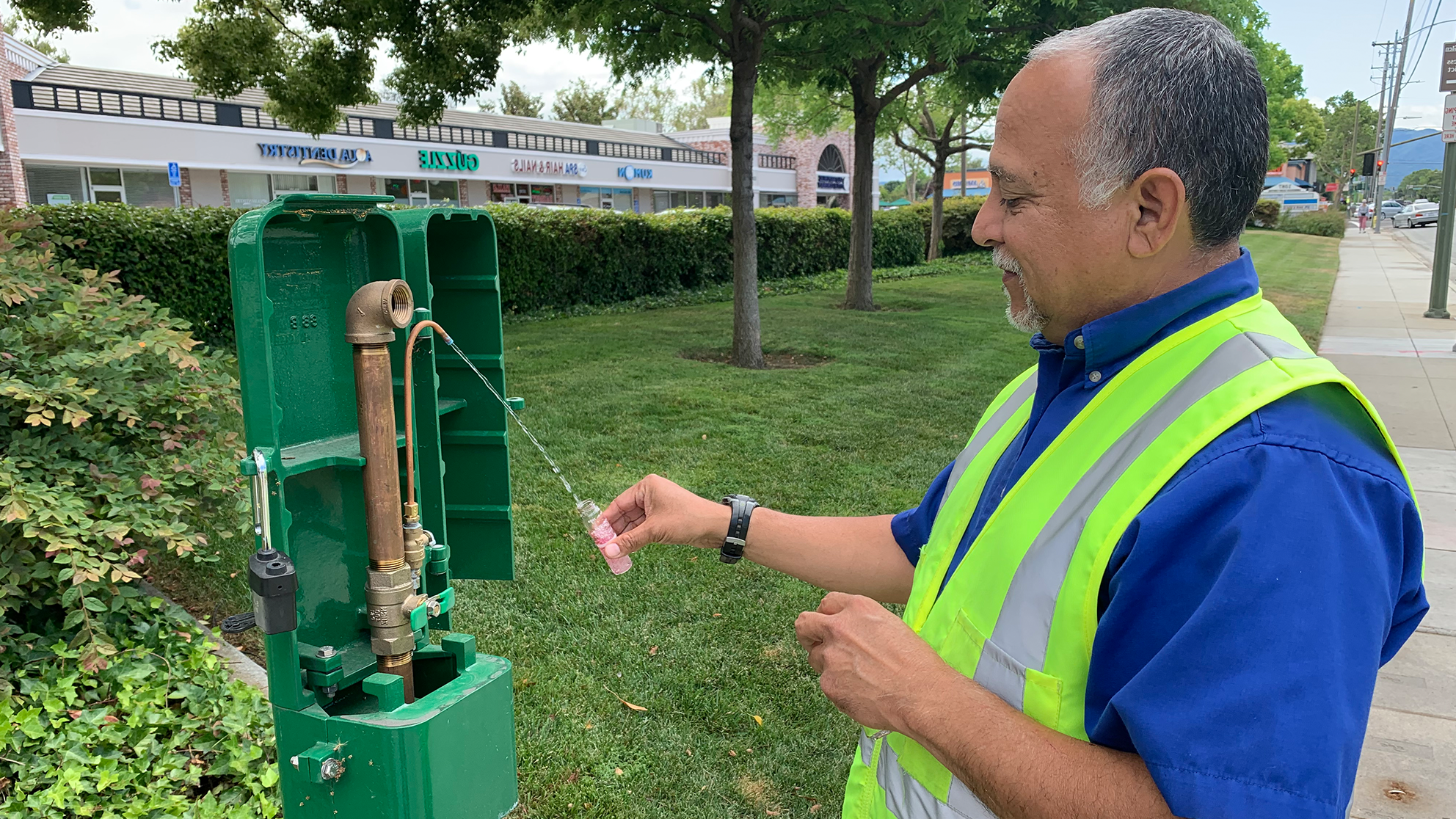 San Jose Water employee checking water outlet